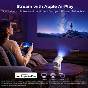 White compact projector on coffee table, projecting in home living room